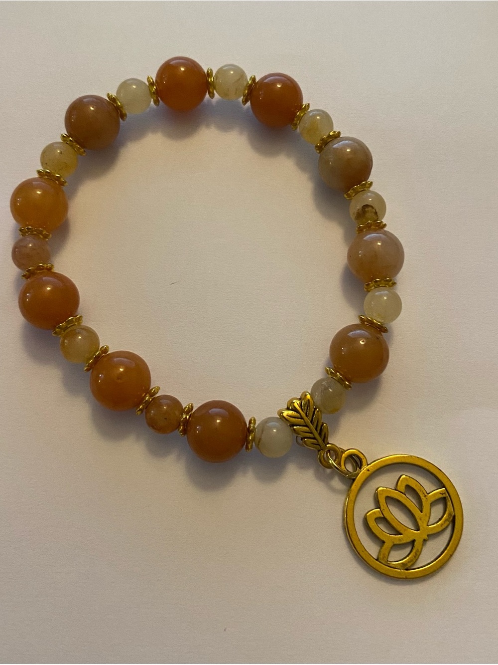 Handcrafted Gold Lotus Charm with Orange-Beige Carnelian beads stretch bracelet